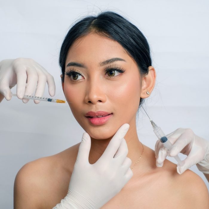 Elegant,Asian,Woman,With,Hair,Up,Receiving,Fat,Reduction,Injection